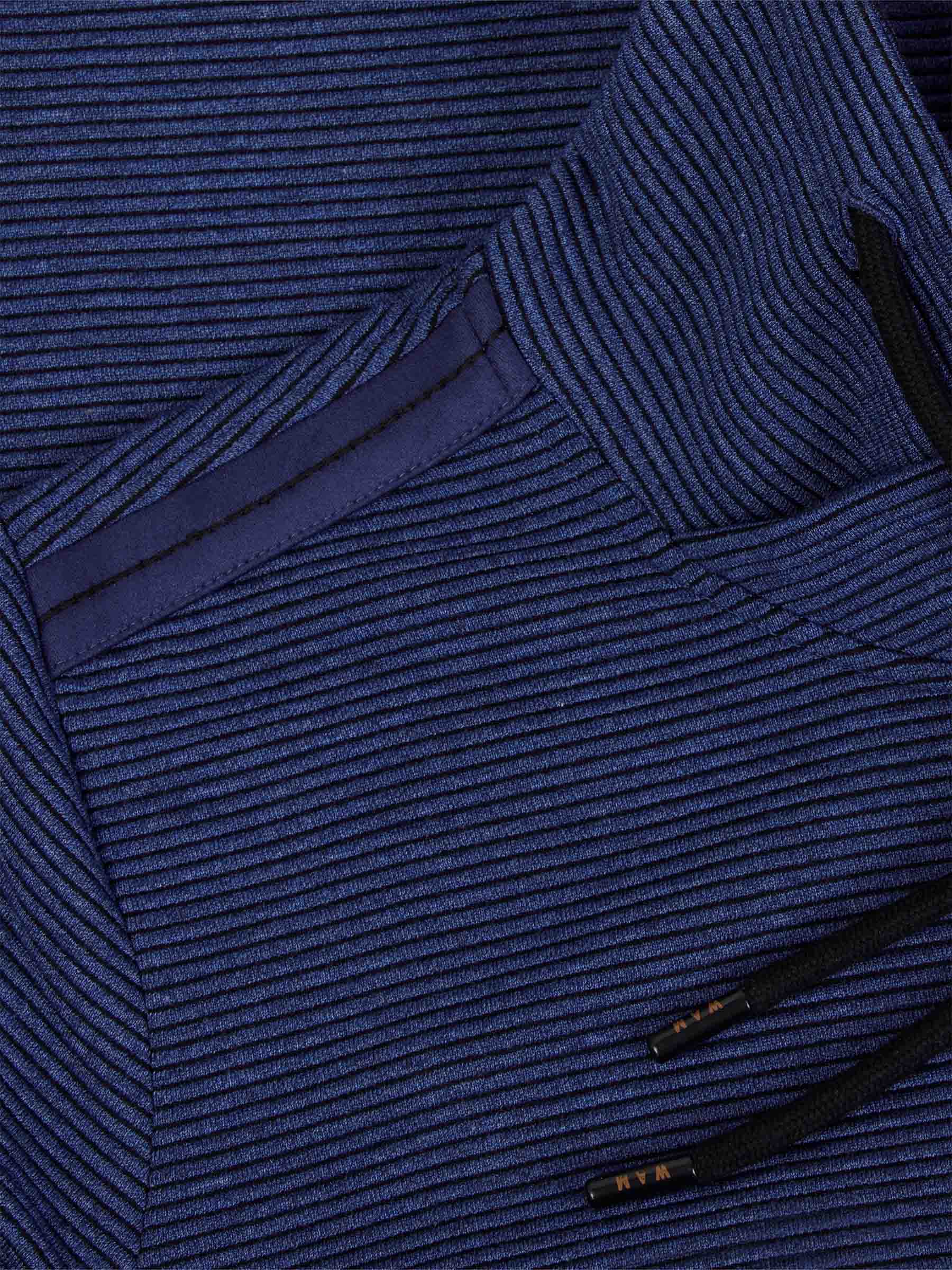 Close-up of the shoulder detail on the blue cowl neck sweater – Wam Denim.