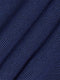 Close-up of the navy blue diagonally ribbed knit fabric – Wam Denim.