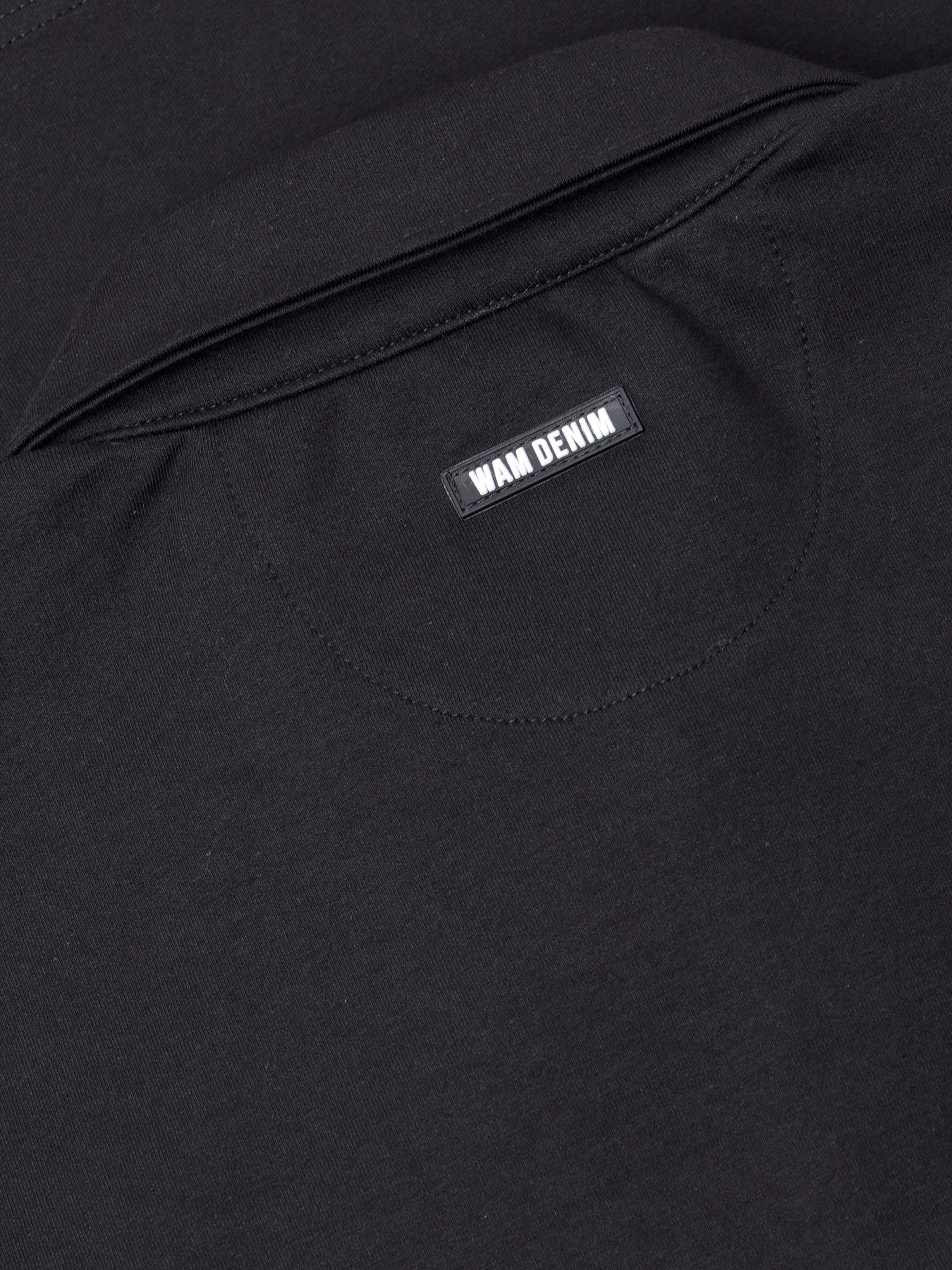 Close-up of The Zeal Black Sweater back collar showing stitched Wam Denim logo label – Wam Denim.