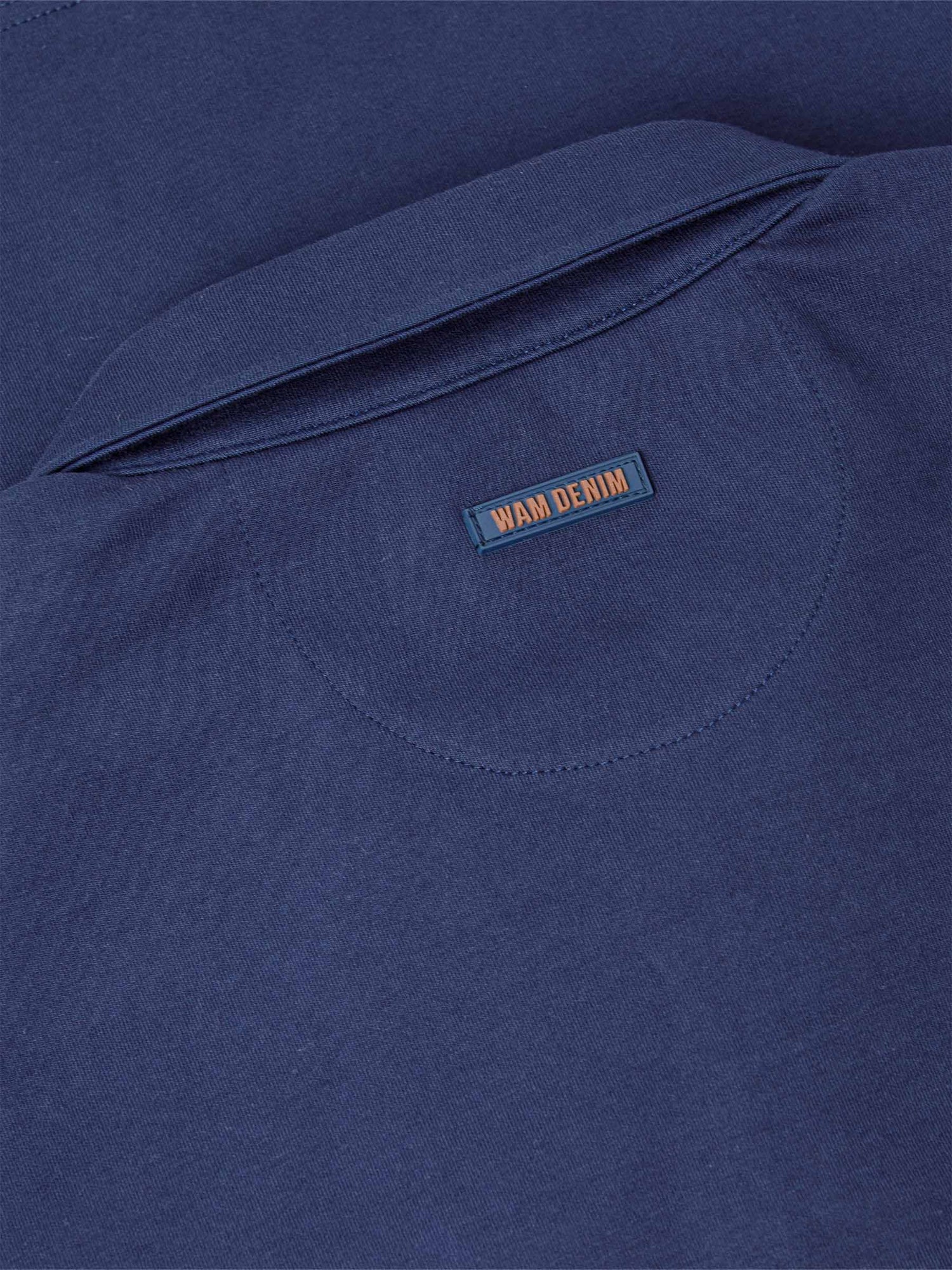Close-up of a Navy Sweater with 'WAM DENIM' label.