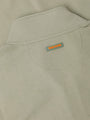 Close-up of a Light Green jacket with a 'WAM Denim' label on the chest pocket.