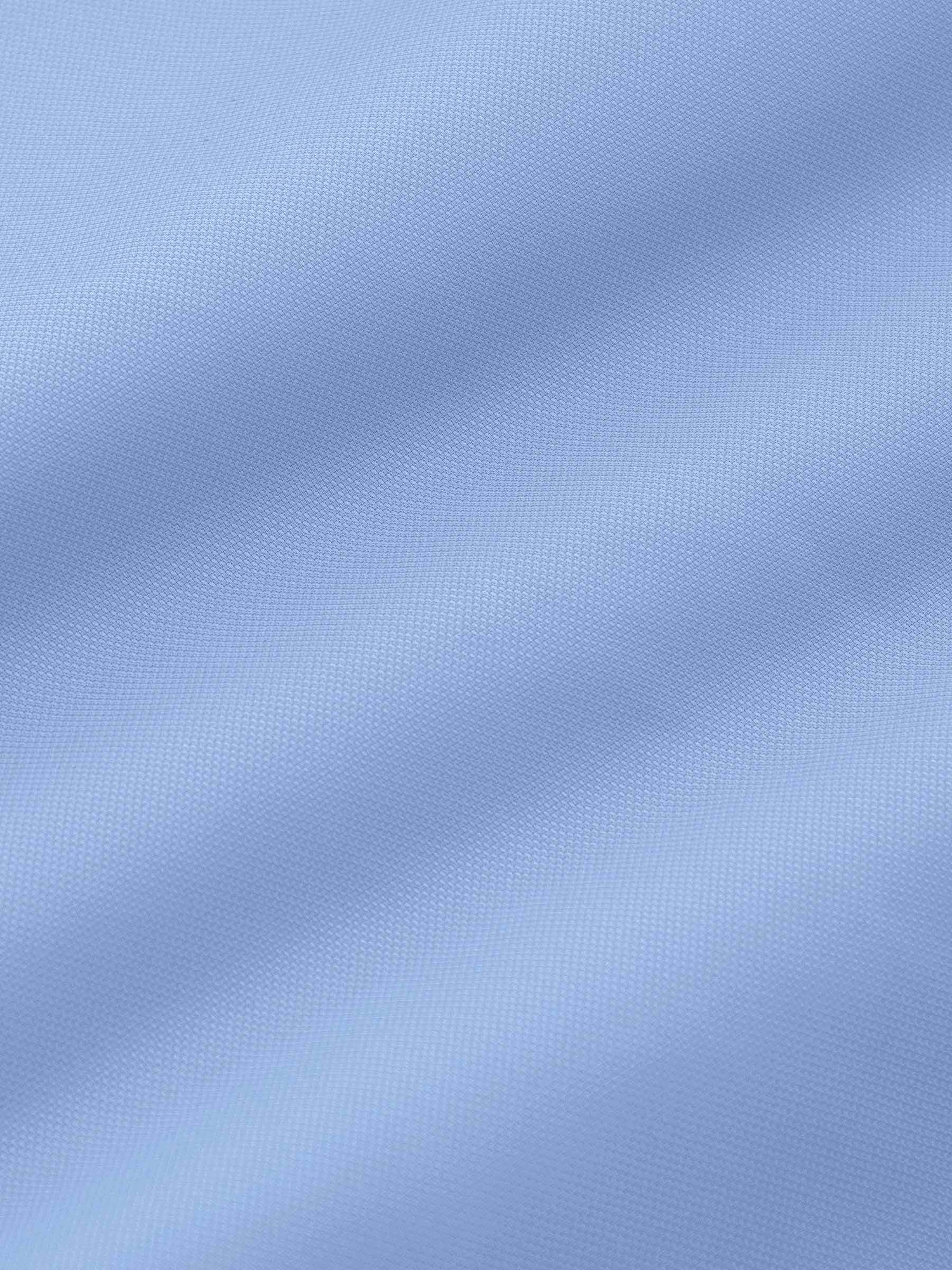 Close-up texture of blue dress shirt fabric, soft and fine weave