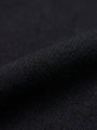 Close-up of black cotton fabric texture, soft breathable material detail