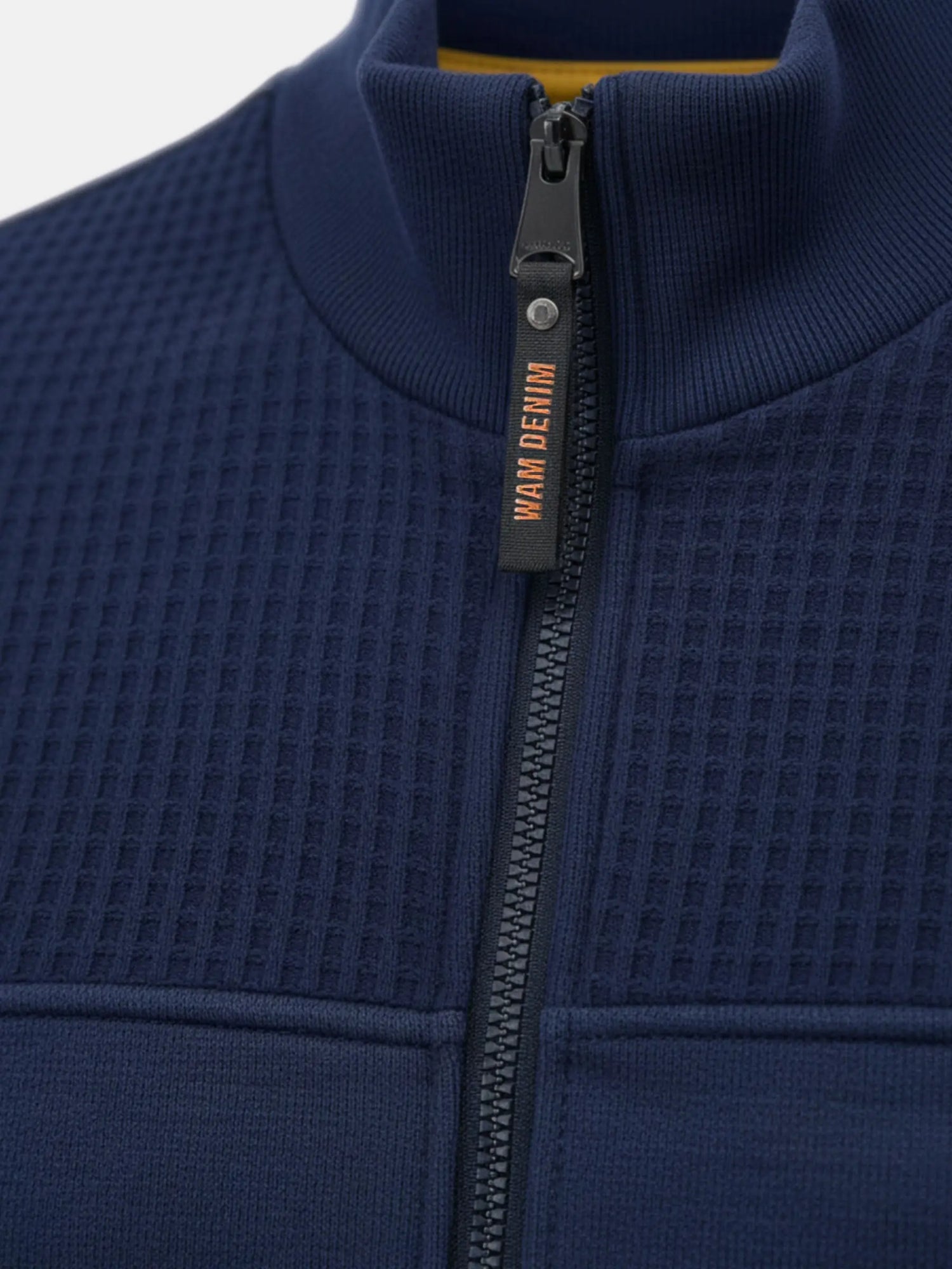 Close-up of Light Indigo jacket zipper and textured fabric on Fletcher Light Indigo design.