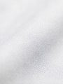 Close-up of white cotton fabric texture from men’s dress shirt