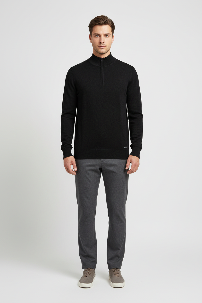 Male model wearing the Wam Denim Halron black quarter-zip knit sweater, front view
