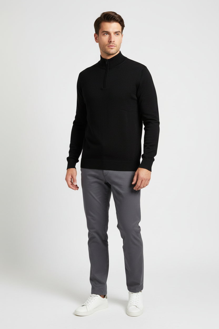 Male model wearing the Halron black quarter-zip sweater in a three-quarter view