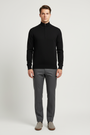 Male model wearing the Wam Denim Sharp black quarter-zip knit sweater, front view