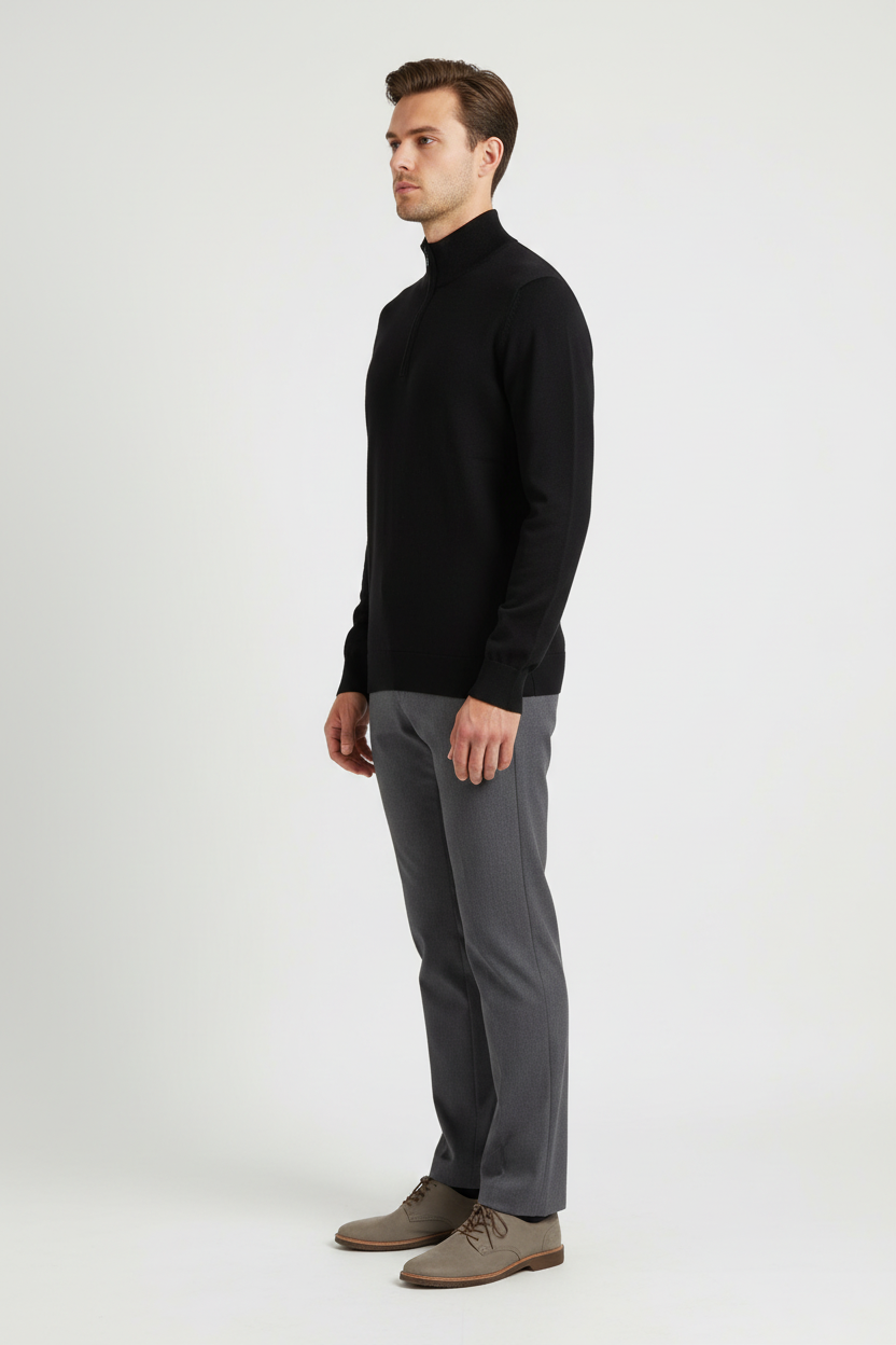 Side view of a male model wearing a black fine-knit quarter-zip sweater