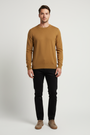 Male model wearing a Wam Denim dark-yellow crew-neck knit sweater, front view