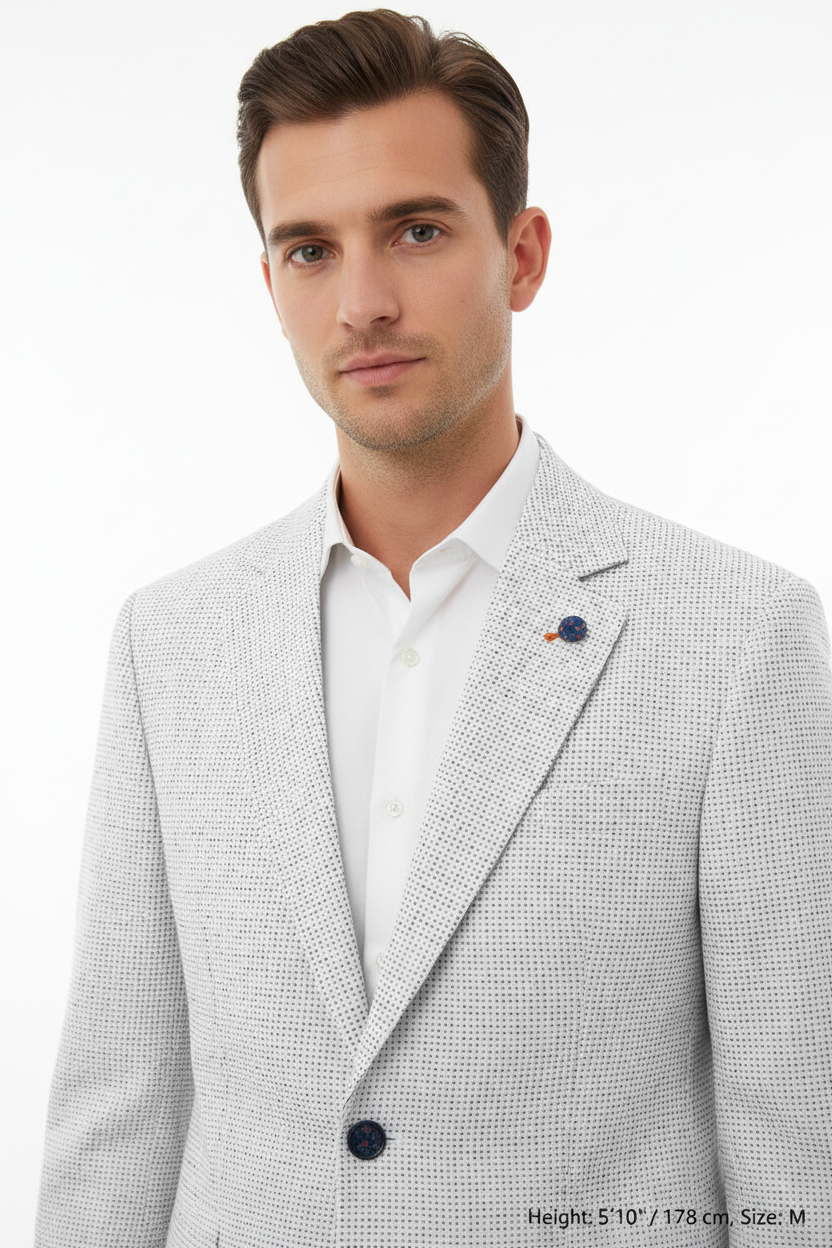 Lapel detail - white textured blazer on model