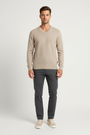 Male model wearing the Wam Denim Forge beige textured V-neck sweater, front view