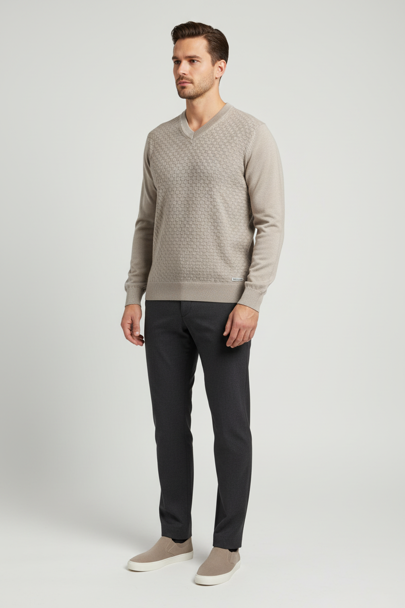 Male model wearing the Forge beige textured V-neck sweater in a three-quarter view