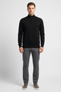 Close view of the ribbed collar, zipper and fine-knit texture of the Halron black sweater