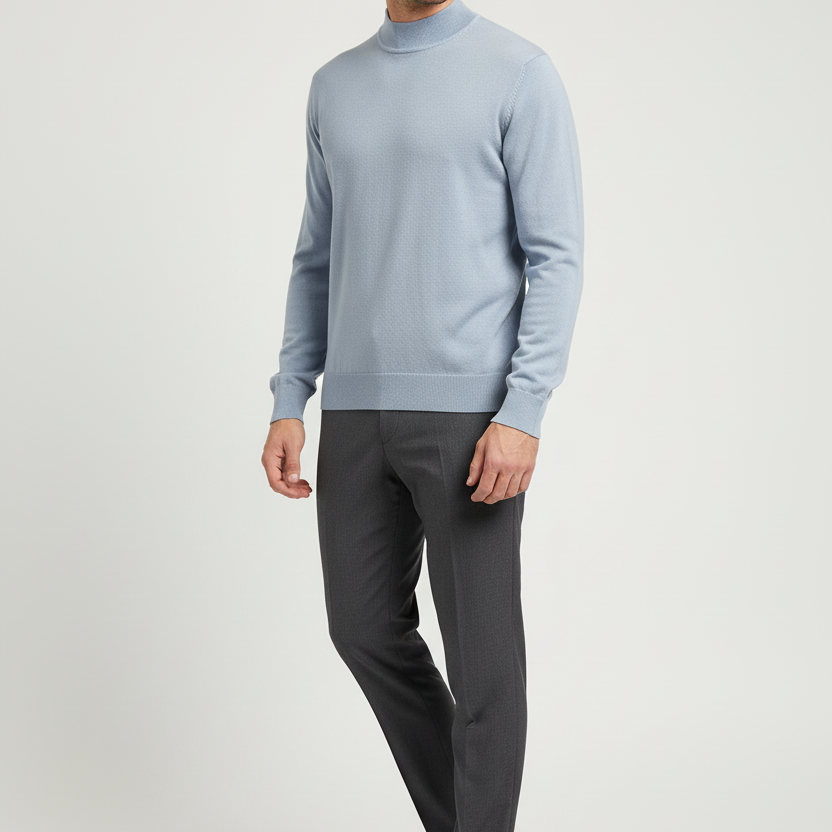Male model wearing the Lux light-blue mock-neck sweater in a three-quarter view