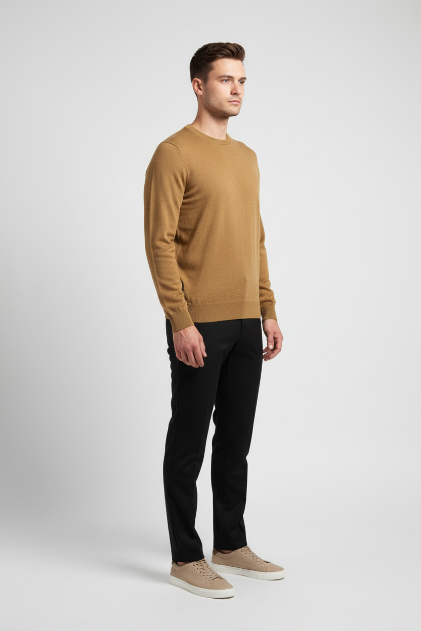 Side view of a male model wearing a dark-yellow fine-knit crew-neck sweater