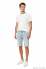 Front 3/4 angle - Yevan Light Blue Denim Shorts on model