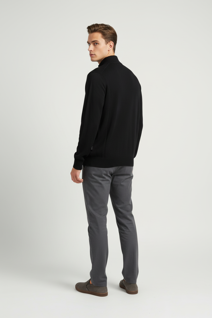 Back view of a male model wearing the Wam Denim Halron black quarter-zip sweater