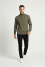 Male model in a walking pose wearing the Wam Denim Shrap khaki pullover