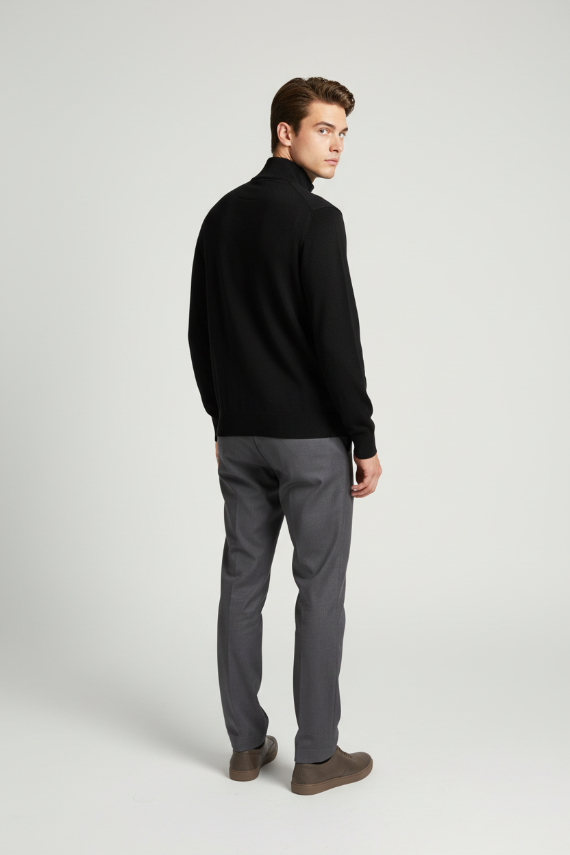 Back view of a male model wearing the Sharp black sweater with Wam Denim neck branding