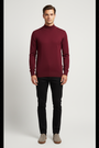 Close view of the high ribbed mock neck and fine-knit texture of the Lux dark-red sweater
