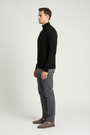 Side view of a male model wearing the Wam Denim Sharp black quarter-zip sweater