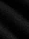 Close-up of dark grey chino fabric showing fine texture and premium woven finish.