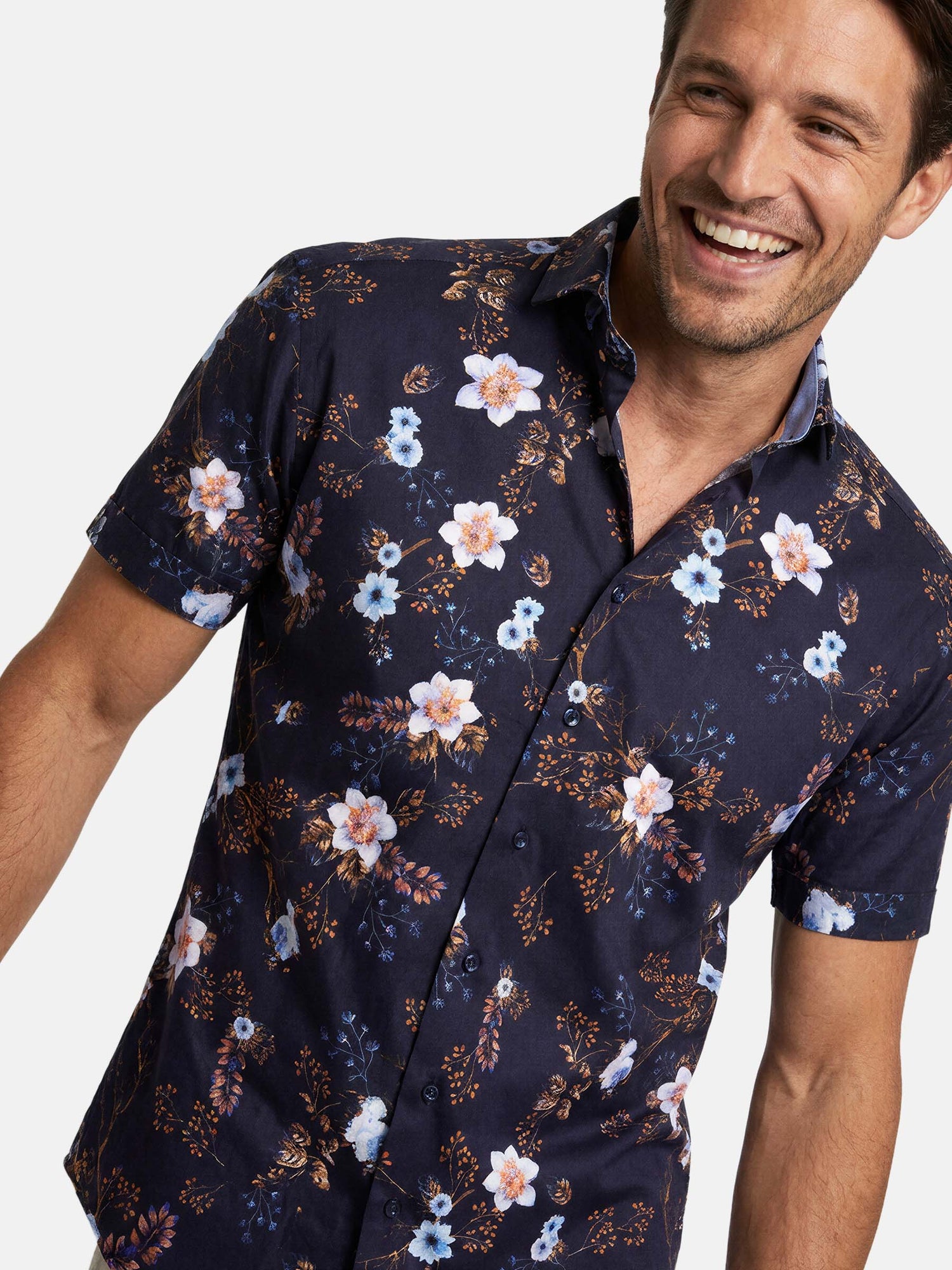Close-up of navy floral men’s shirt with short sleeves and tailored fit