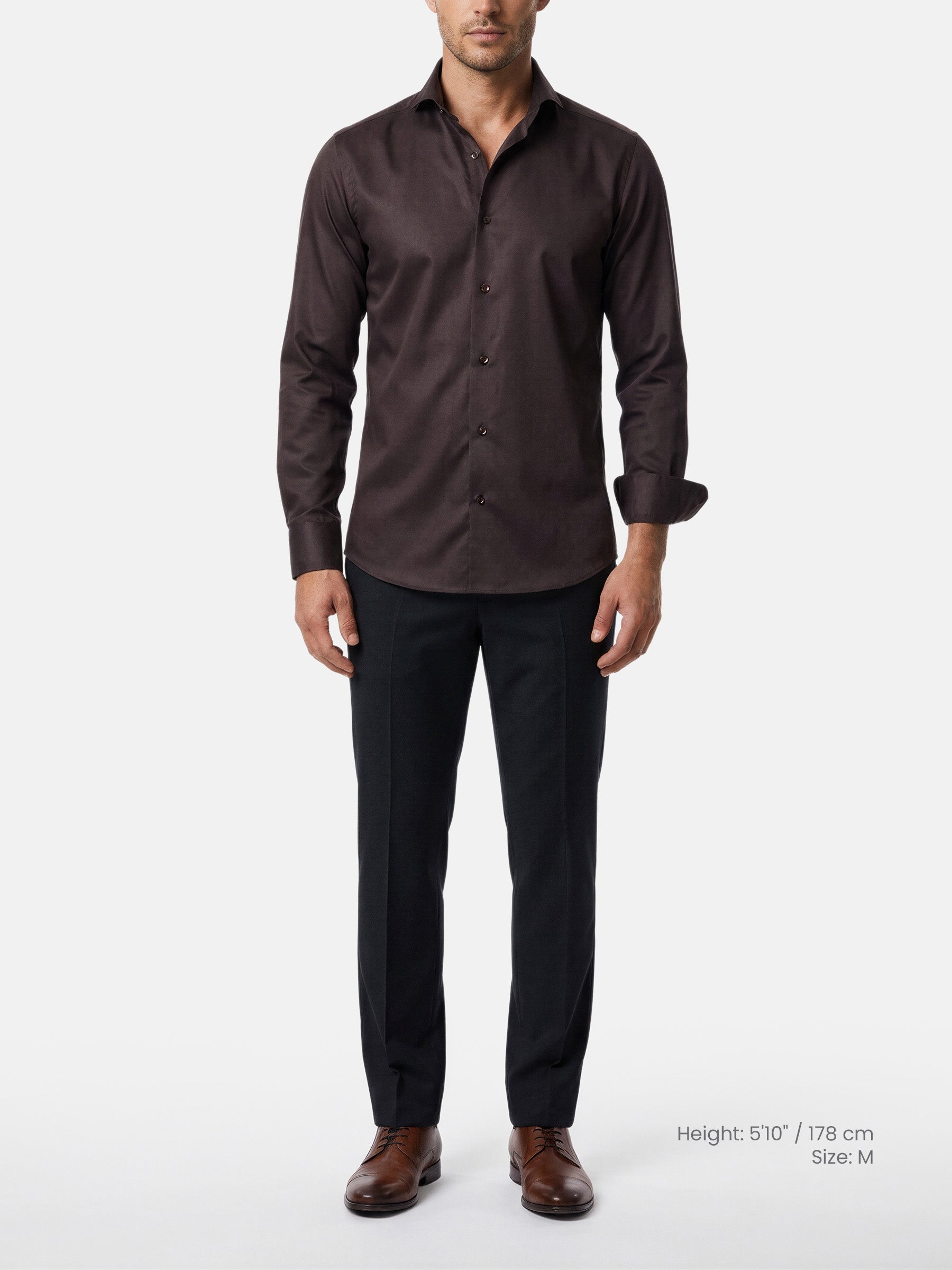 Model wearing brown tailored fit men’s shirt with black trousers and brown shoes