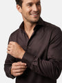 Close-up of brown tailored fit men’s shirt with classic collar and cuff detail