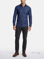 Model wearing navy tailored fit shirt styled with dark trousers and brown shoes