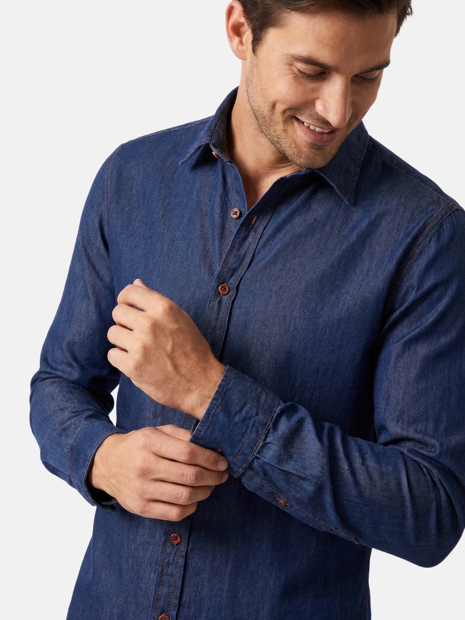 Close-up of navy tailored fit men’s shirt with classic collar and button details