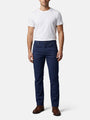 Men wearing navy slim-fit jeans styled with white T-shirt and brown leather shoes