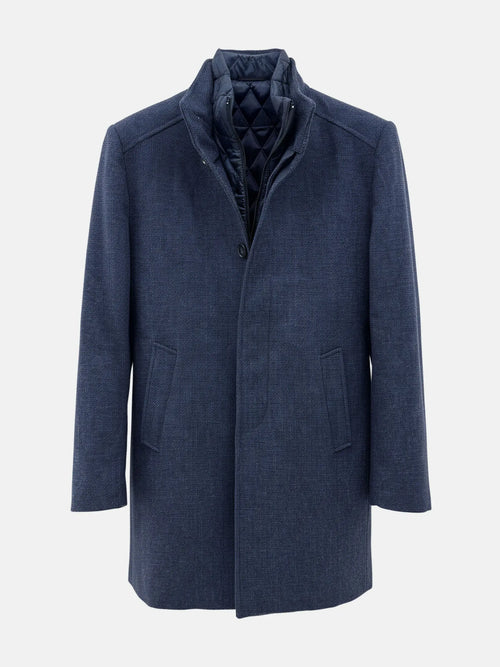 Light navy men’s trenchcoat with quilted inner lining and front button closure for winter.