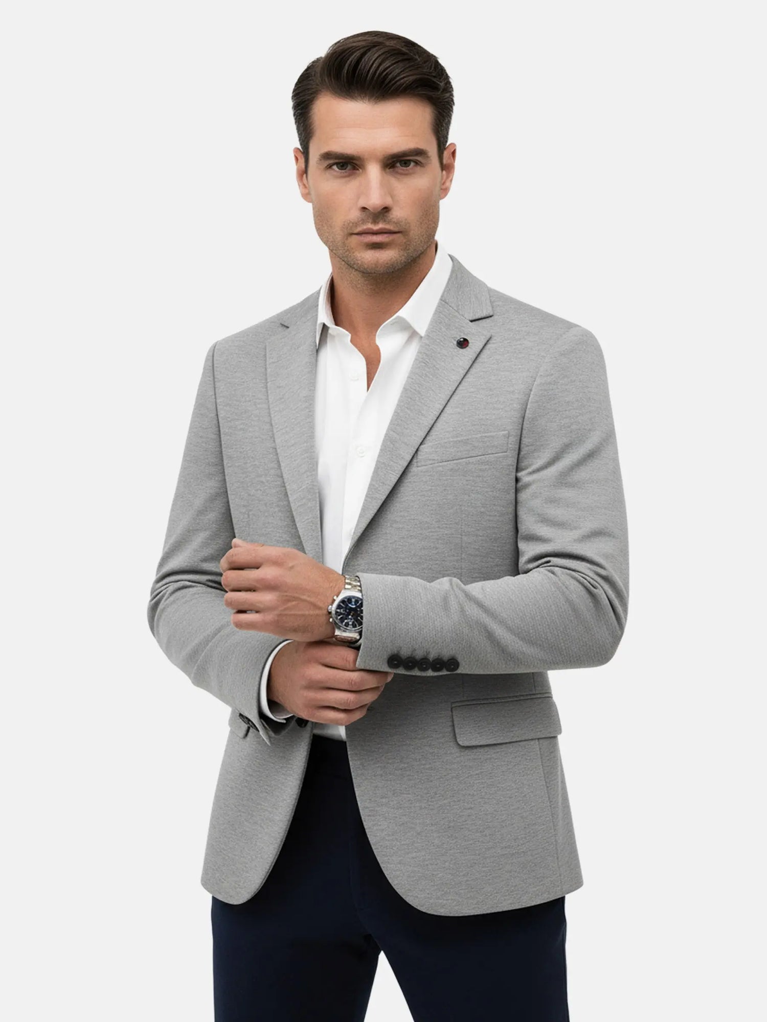 Model wearing light grey blazer with white dress shirt, smart formal look.