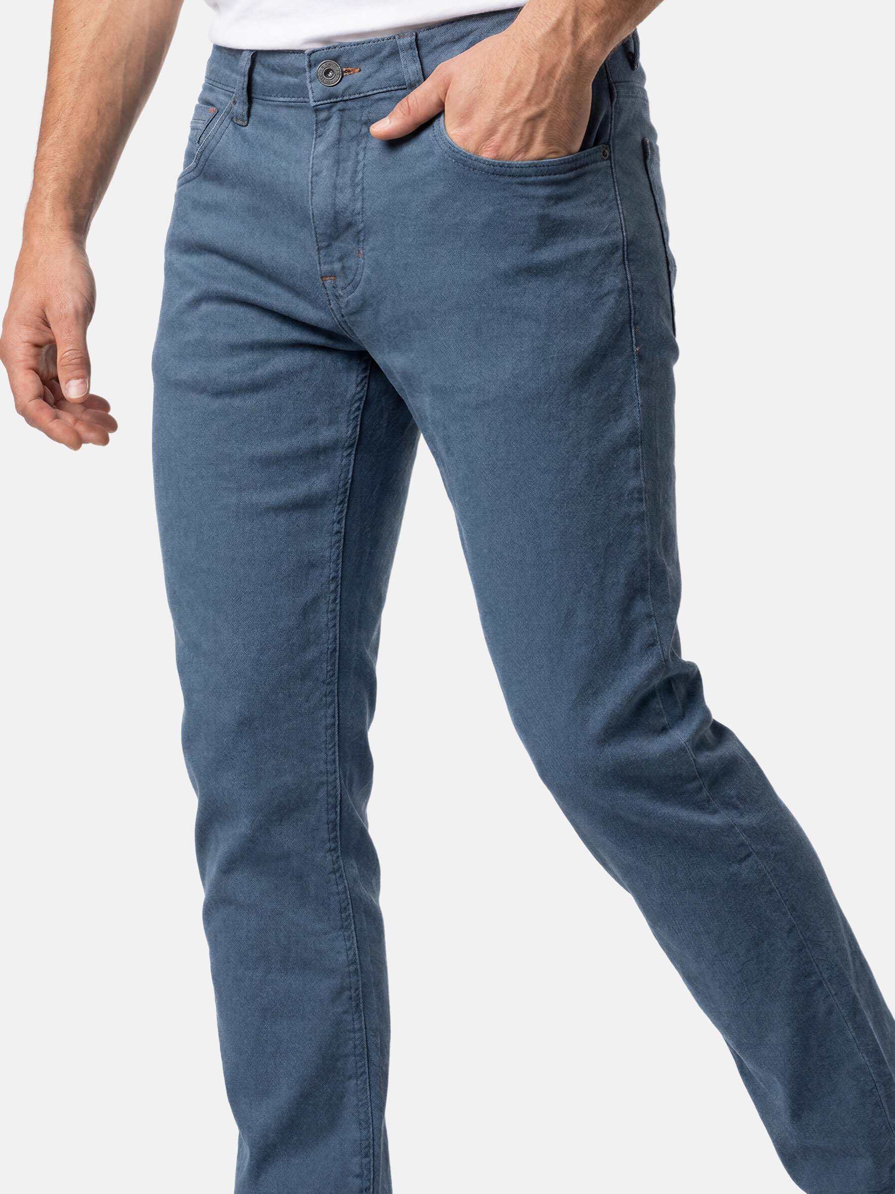 Close-up of slim fit blue men’s stretch denim jeans.