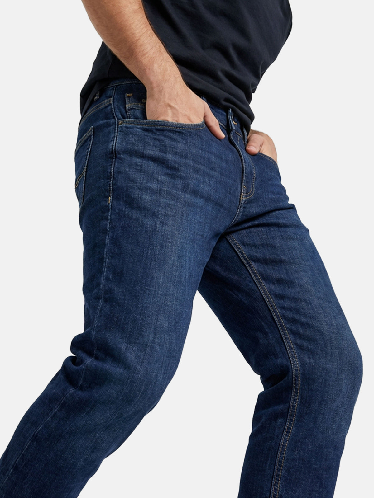 Close-up side view of blue jeans showing slim fit and stretch denim fabric