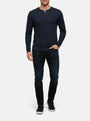 Model wearing navy long-sleeve men’s sweater with buttoned neckline, Zest Navy style.