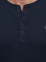 Close-up of navy Zest sweater buttons and textured knit fabric.